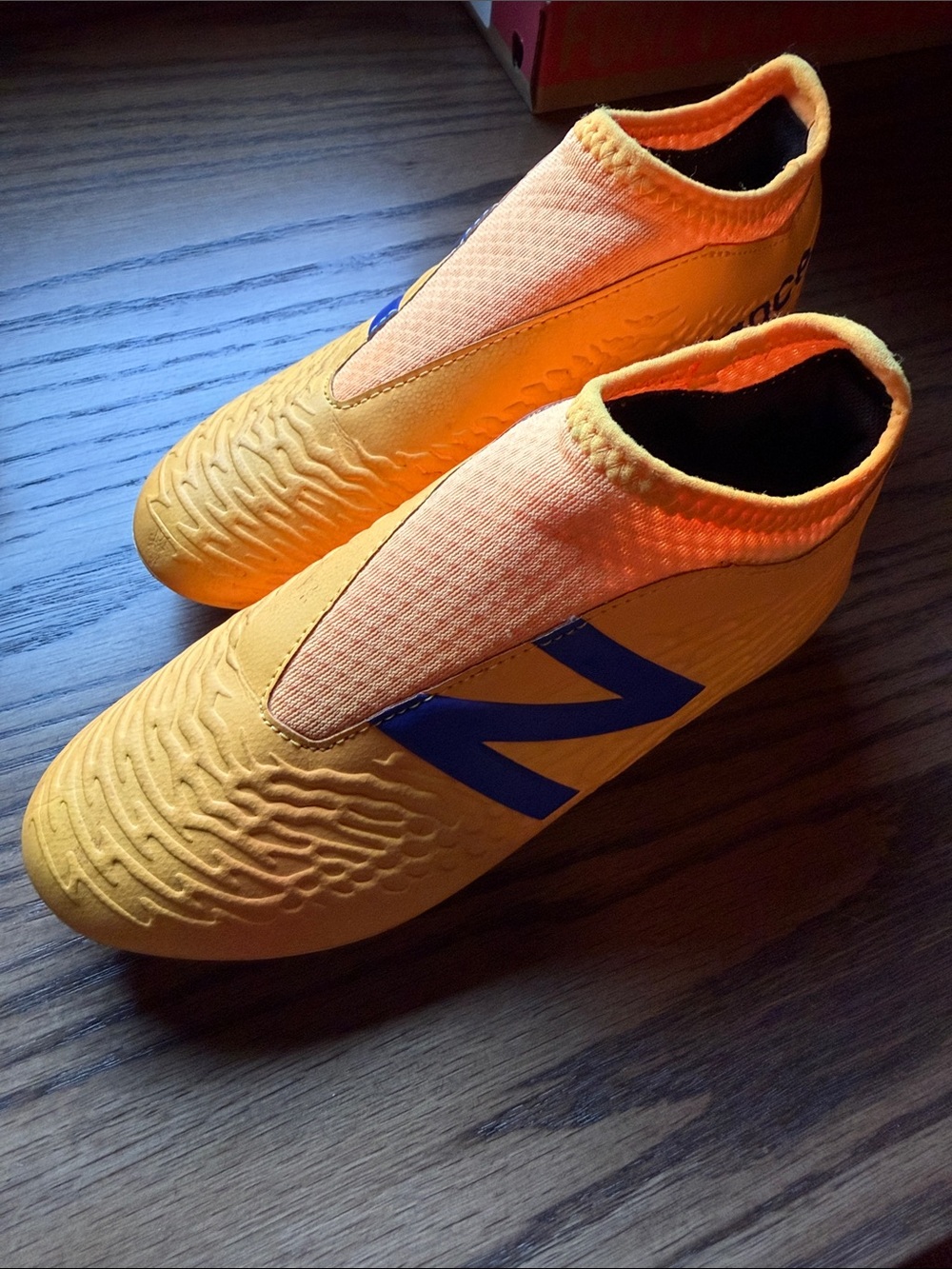 NEW BALANCE TEKELA 3.0+ MAGIQUE FG VIVID SPARK - ORANGE KIDS